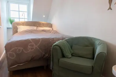 Ein Bett oder Betten in einem Zimmer der Unterkunft Ferienwohnung Kleine Strandkoje