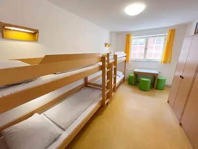Ein Bett oder Betten in einem Zimmer der Unterkunft Jugendherberge Lübeck Altstadt