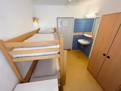 Ein Bett oder Betten in einem Zimmer der Unterkunft Jugendherberge Lübeck Altstadt