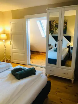 Ein Bett oder Betten in einem Zimmer der Unterkunft Ferienwohnung C im Ferienhaus Antika