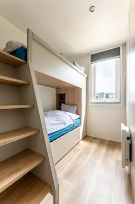 Ein Bett oder Betten in einem Zimmer der Unterkunft Düne 46