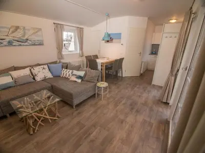 Ein Sitzbereich in der Unterkunft Strand 4