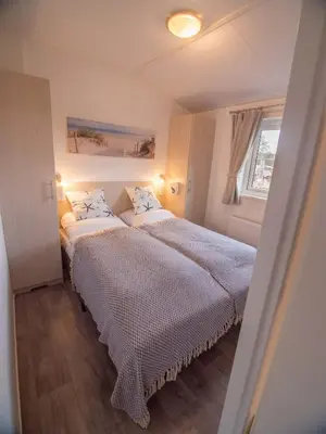 Ein Bett oder Betten in einem Zimmer der Unterkunft Strand 5