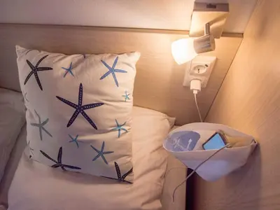 Ein Bett oder Betten in einem Zimmer der Unterkunft Strand 8