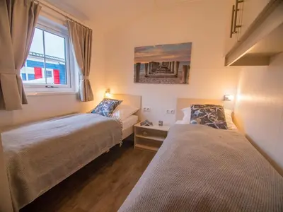 Ein Bett oder Betten in einem Zimmer der Unterkunft Strand 8
