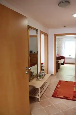 Ein Bett oder Betten in einem Zimmer der Unterkunft Ferienwohnung zum weißen Schwan