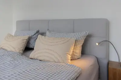 Ein Bett oder Betten in einem Zimmer der Unterkunft Ferienwohnung 54 Grad Nord - Haffkrug