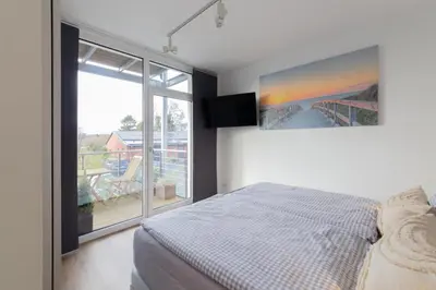 Ein Bett oder Betten in einem Zimmer der Unterkunft Ferienwohnung 54 Grad Nord - Haffkrug