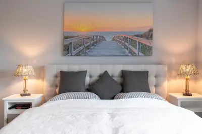 Ein Bett oder Betten in einem Zimmer der Unterkunft Exklusive Ferienwohnung Meerliebe