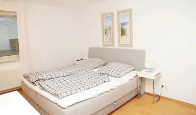 Ein Bett oder Betten in einem Zimmer der Unterkunft HansaResidenz Scharbeutz