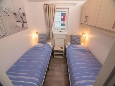 Ein Bett oder Betten in einem Zimmer der Unterkunft Pier98 22