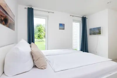 Ein Bett oder Betten in einem Zimmer der Unterkunft Wohnung 2