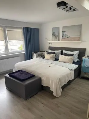 Ein Bett oder Betten in einem Zimmer der Unterkunft Ostsee Ferienwohnung Möwengasse