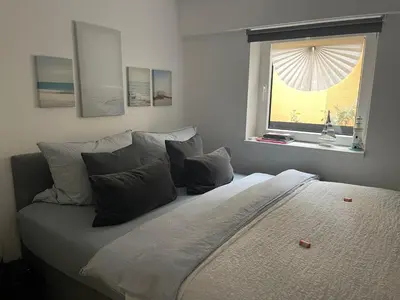 Ein Bett oder Betten in einem Zimmer der Unterkunft Ostsee Ferienwohnung Möwengasse