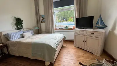 Ein Bett oder Betten in einem Zimmer der Unterkunft gemütliche Wohnung