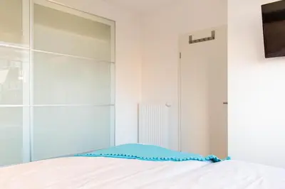 Ein Bett oder Betten in einem Zimmer der Unterkunft Ferienwohnung Sea Breeze Scharbeutz bietet Platz für bis zu 6 Personen in zentraler Lage von Scharbeutz