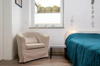 Ein Bett oder Betten in einem Zimmer der Unterkunft Ferienwohnung Sea Breeze Scharbeutz bietet Platz für bis zu 6 Personen in zentraler Lage von Scharbeutz
