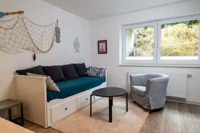 Ein Sitzbereich in der Unterkunft Ferienwohnung Sea Breeze Scharbeutz bietet Platz für bis zu 6 Personen in zentraler Lage von Scharbeutz