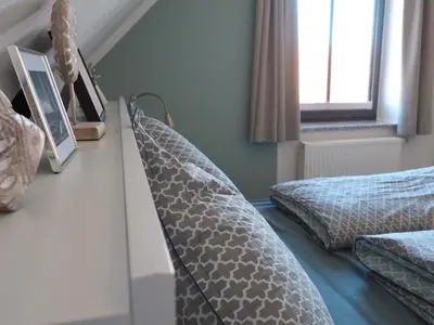 Ein Bett oder Betten in einem Zimmer der Unterkunft Timmenstrand
