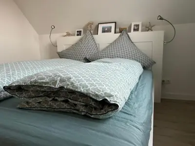 Ein Bett oder Betten in einem Zimmer der Unterkunft Timmenstrand