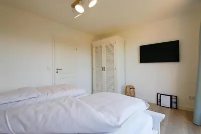 Ein Bett oder Betten in einem Zimmer der Unterkunft Cooles Ferienhaus HAFF COAST im Surfer-Style in Scharbeutz - Haffkrug