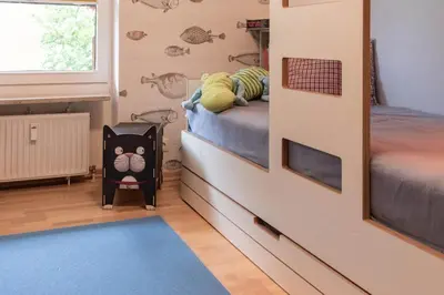 Ein Bett oder Betten in einem Zimmer der Unterkunft Ferienwohnung Gartenkoje - Haffkrug