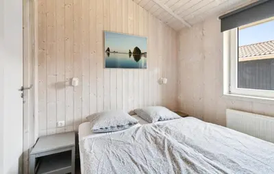 Ein Bett oder Betten in einem Zimmer der Unterkunft Dünenpark 2B - Dorf 4
