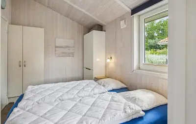 Ein Bett oder Betten in einem Zimmer der Unterkunft Freibeuterweg 21 - Dorf 5