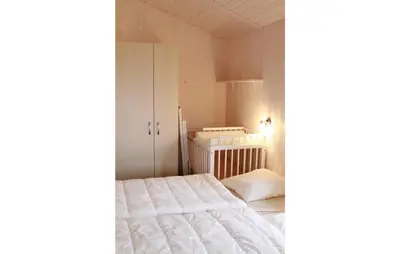 Ein Bett oder Betten in einem Zimmer der Unterkunft Pulverhorn 9 - Dorf 4