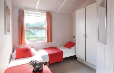 Ein Bett oder Betten in einem Zimmer der Unterkunft Dünenpark 15 - Dorf 6