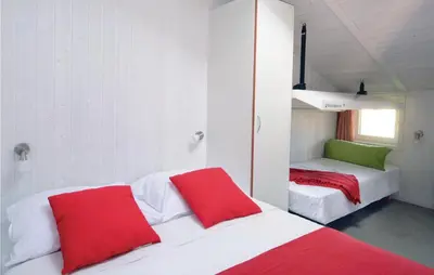 Ein Bett oder Betten in einem Zimmer der Unterkunft Meeresrauschen 5 - Dorf 6