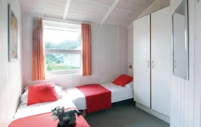 Ein Bett oder Betten in einem Zimmer der Unterkunft Meeresrauschen 5 - Dorf 6
