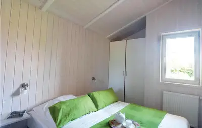 Ein Bett oder Betten in einem Zimmer der Unterkunft Meeresrauschen 5 - Dorf 6