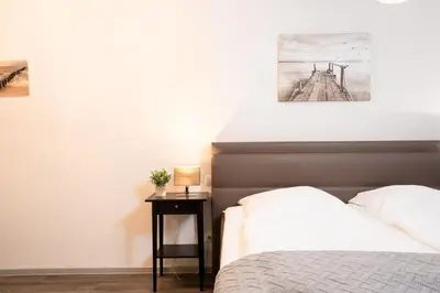 Ein Bett oder Betten in einem Zimmer der Unterkunft Strandvilla Augustusbad Wohnung 1