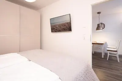 Ein Bett oder Betten in einem Zimmer der Unterkunft Strandvilla Augustusbad Wohnung 1