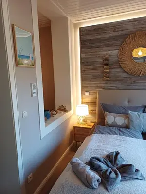 Ein Bett oder Betten in einem Zimmer der Unterkunft Strandallee Ferienwohnung