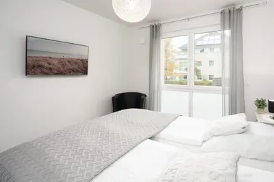 Ein Bett oder Betten in einem Zimmer der Unterkunft Strandvilla Augustusbad Wohnung 10