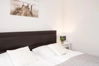 Ein Bett oder Betten in einem Zimmer der Unterkunft Strandvilla Augustusbad Wohnung 10