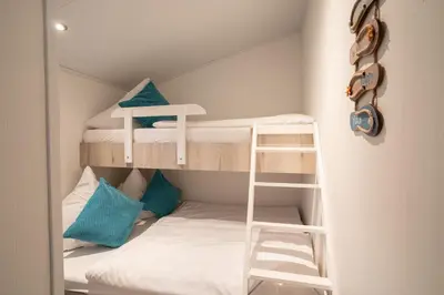 Ein Bett oder Betten in einem Zimmer der Unterkunft Ostseecamp Lübecker Bucht Seeigel