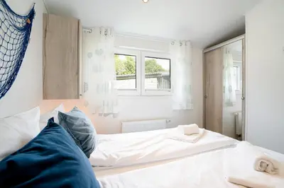 Ein Bett oder Betten in einem Zimmer der Unterkunft Ostseecamp Lübecker Bucht Strandläufer