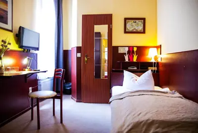 Ein Bett oder Betten in einem Zimmer der Unterkunft Hotel Hanseatic Lübeck