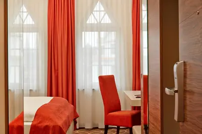 Ein Bett oder Betten in einem Zimmer der Unterkunft H+ Hotel Lübeck