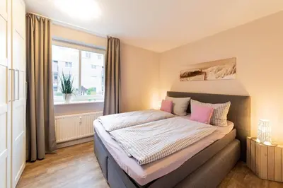 Ein Bett oder Betten in einem Zimmer der Unterkunft Ferienwohnung Beach Life 4 - Scharbeutz
