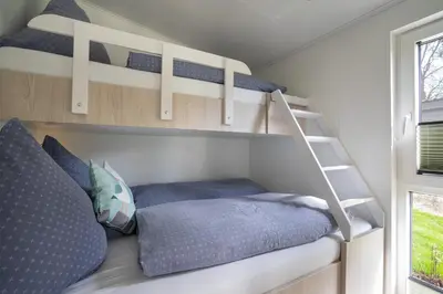 Ein Bett oder Betten in einem Zimmer der Unterkunft Ferienhaus 