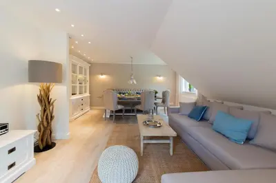 Ein Sitzbereich in der Unterkunft Ferienwohnung Neptuns Auszeit in Haffkrug