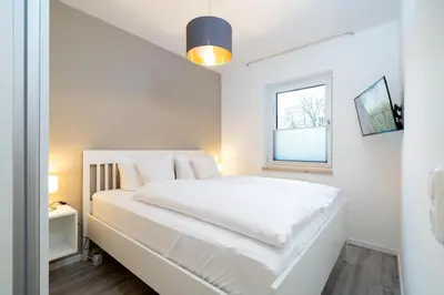 Ein Bett oder Betten in einem Zimmer der Unterkunft Alte Bergstraße 6 Sehnsucht