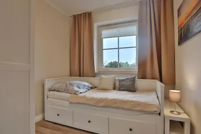 Ein Bett oder Betten in einem Zimmer der Unterkunft Wohnpark Niendorf 13 Wohnpark Niendorf 13 Appartement 04