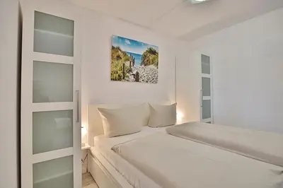 Ein Bett oder Betten in einem Zimmer der Unterkunft Strandresidenz Timmendorfer Strand Strandresidenz Appartement 108
