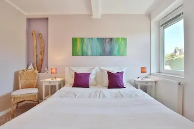 Ein Bett oder Betten in einem Zimmer der Unterkunft Ferienbungalow Erlenweg 20 Erlenweg 20 Appartement 1 Niendorf Ostsee