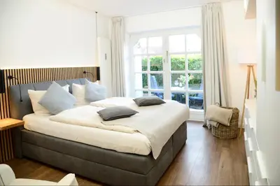 Ein Bett oder Betten in einem Zimmer der Unterkunft Am Rosenhain 14 Am Rosenhain 14 Appartement 3